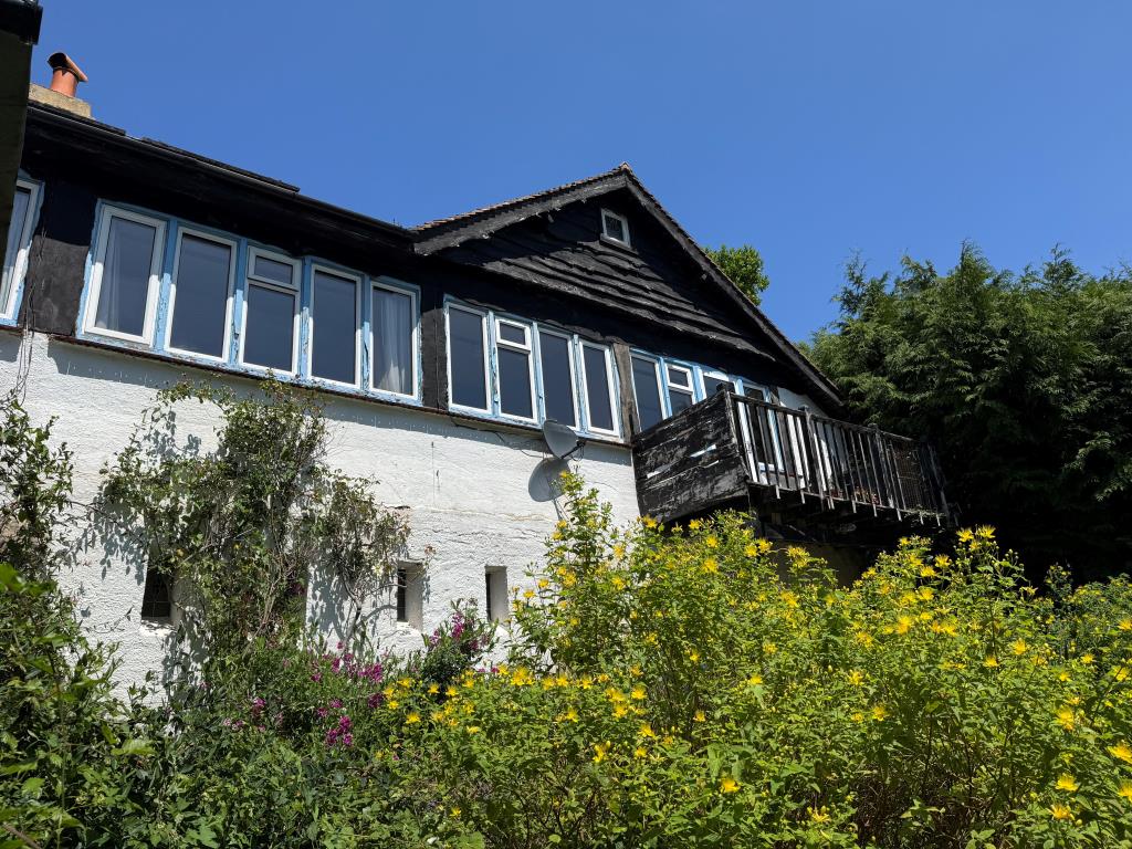 Lot: 117 - FREEHOLD DETACHED HOME WITH SIGNIFICANT STRUCTURAL DAMAGE - Looking Up at the Rear of the Building